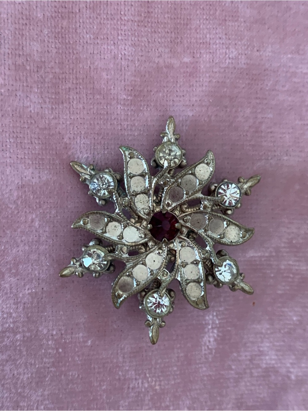 Vintage-Inspired Silver Starburst Brooch with Red Center